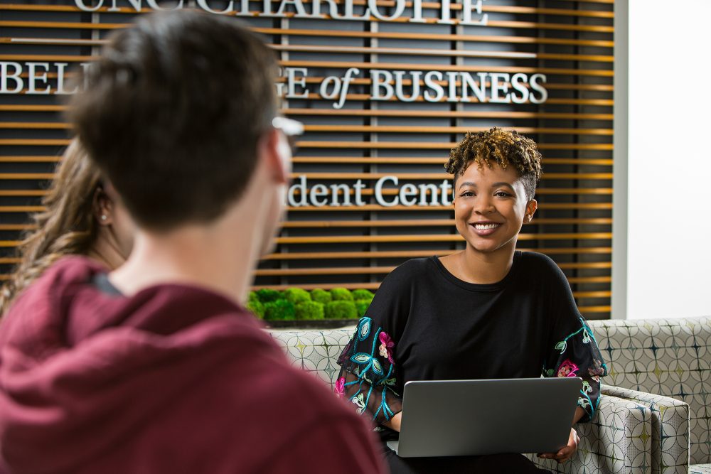 Three undergraduate students studying in the Niblock Student Center.