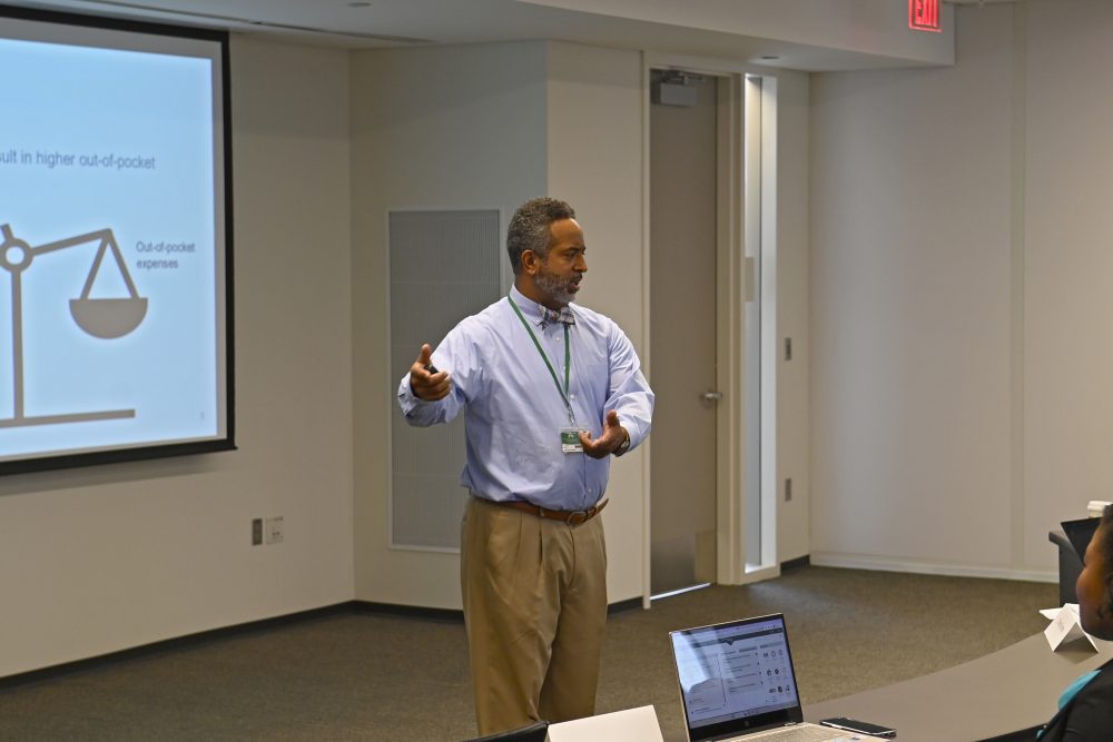 Dr. Reginald Silver lecturing in a classroom