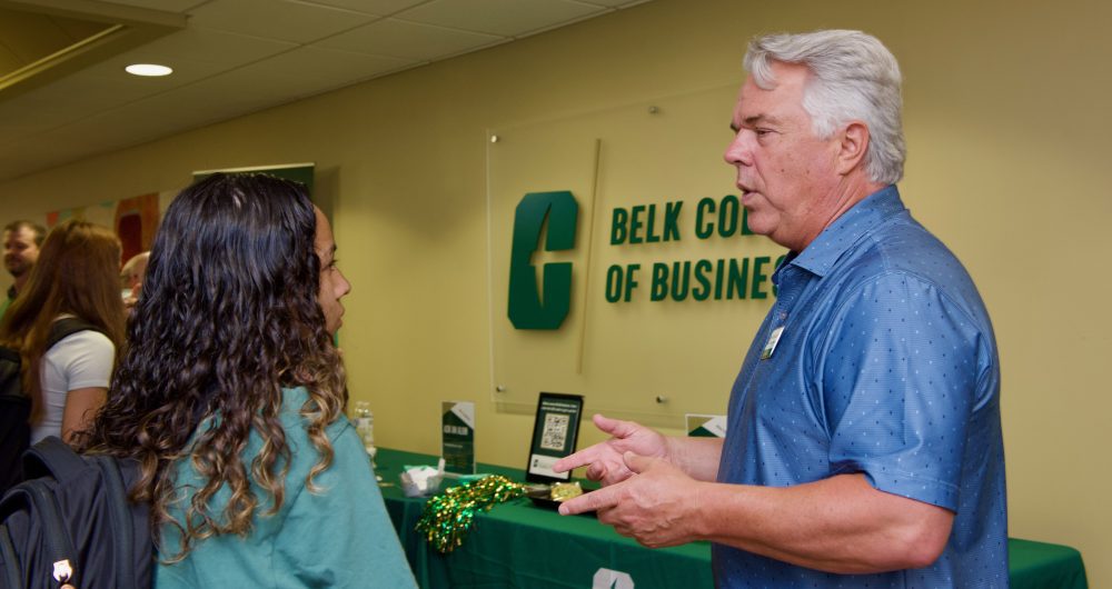 Belk College of Business alumni and student as the Ask the Alum table.