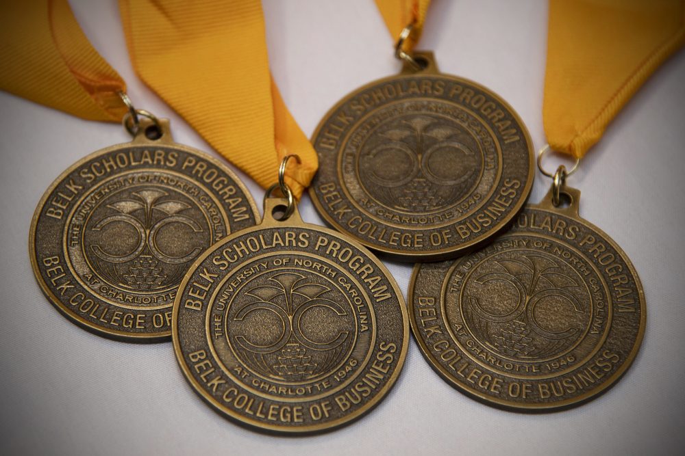 Four Belk Scholars Program medals