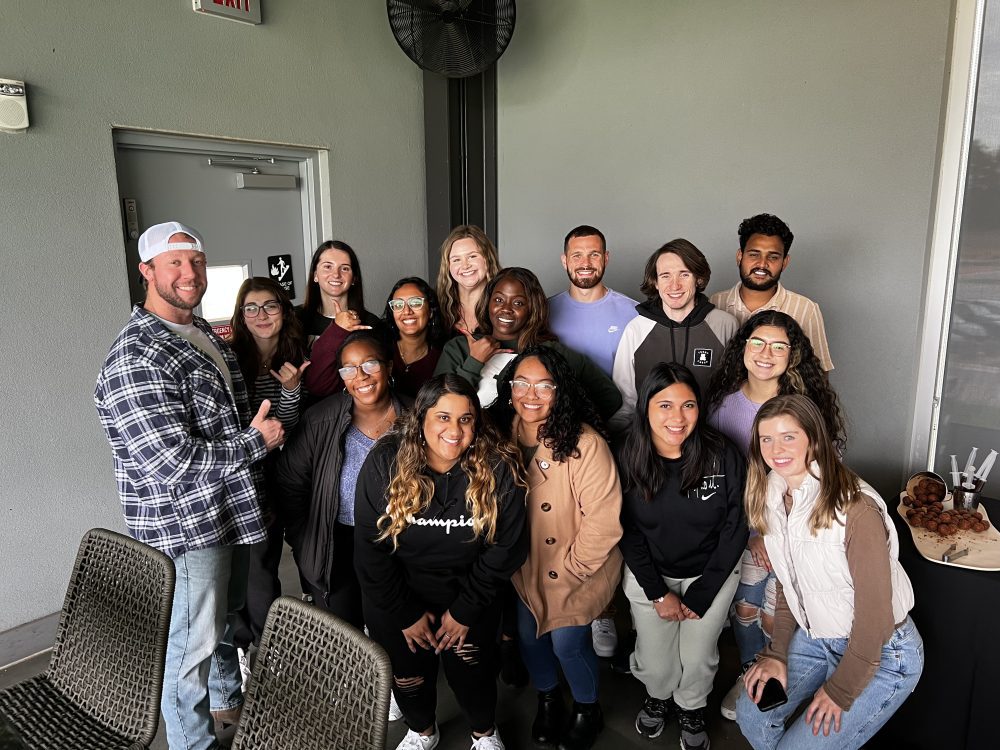 UNC Charlotte's M.S. in Management cohort celebrates at Top Golf in November 2023.
